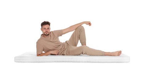 Photo of Man lying on soft mattress against white background