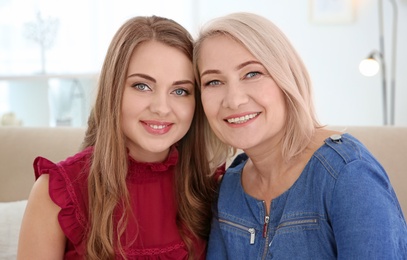 Young daughter and her mother at home
