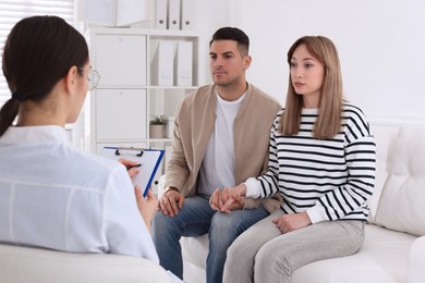 Photo of Couple having appointment with STD specialist in clinic
