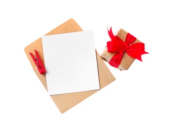 Blank card, envelope and gift box on white background, top view. Valentine's Day celebration