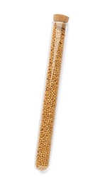 Glass tube with mustard seeds on white background, top view
