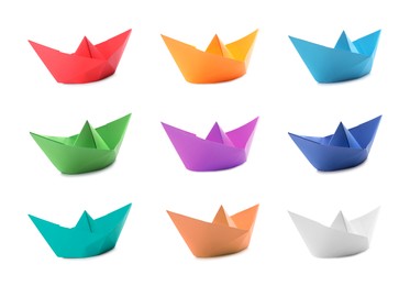 Set with multicolor paper boats on white background