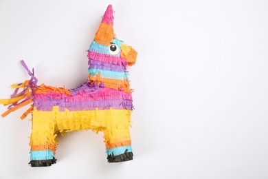 Photo of llama shaped pinata on white background, top view
