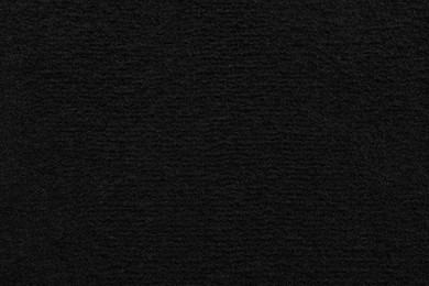 Photo of Texture of black car floor carpet as background, top view