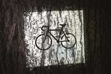 Traffic sign Local Bicycle Route painted on wooden bark, closeup