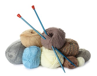 Different balls of woolen knitting yarns on white background