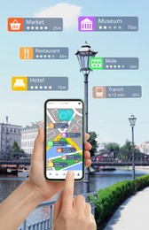 Tourist using online guide application on smartphone for navigation in city, closeup 