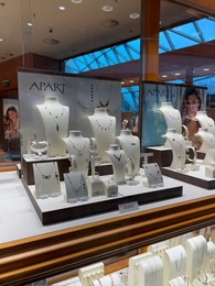WARSAW, POLAND - JULY 17, 2022: Showcase with beautiful jewelry of Apart store in shopping mall