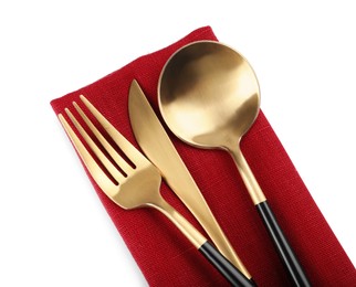 Red napkin with golden cutlery on white background, top view