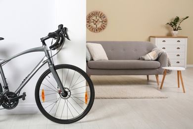 Modern apartment interior with bicycle near wall