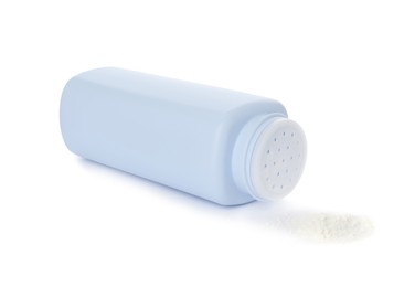 Photo of Bottle and scattered dusting powder on white background. Baby cosmetic product