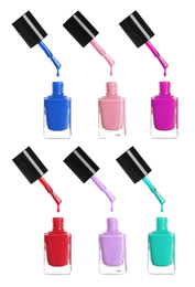 Set of different nail polishes dripping on white background