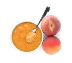 Photo of Peach puree in bowl and fresh fruits on white background, top view