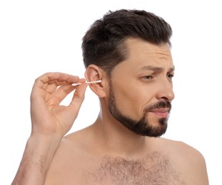 Photo of Emotional man cleaning ears and suffering from pain on white background