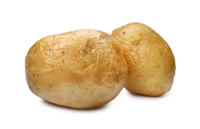 Tasty whole baked potatoes on white background