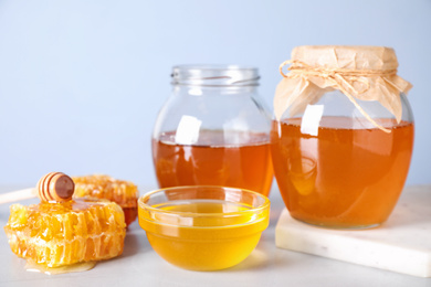 Tasty fresh organic honey on white table