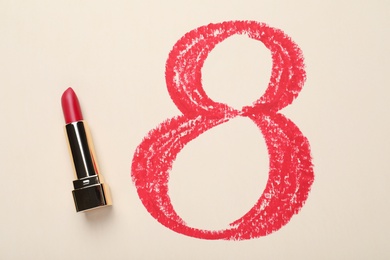 Photo of 8 March greeting card design with lipstick on light background, top view. International Women's day