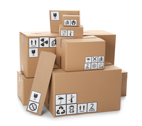 Stacks of cardboard boxes with different packaging  symbols on white background. Parcel delivery