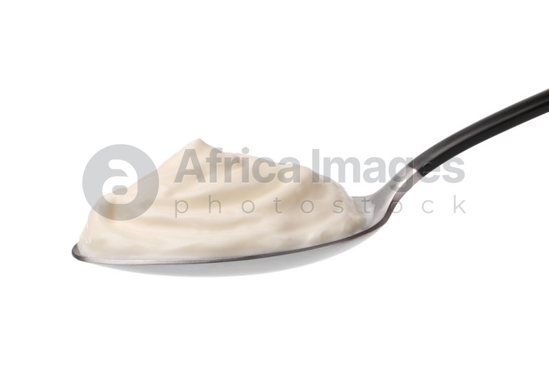 Delicious sour cream in spoon on white background