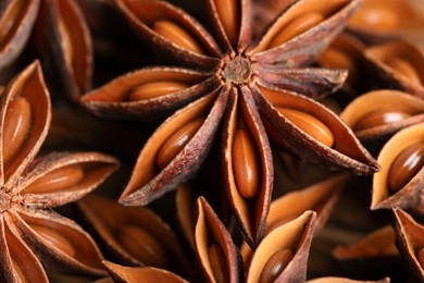 Many aromatic anise stars on table, closeup