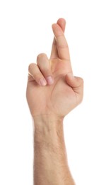 Man with crossed fingers on white background, closeup. Superstition concept
