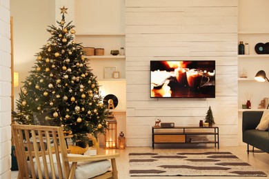 Plasma TV on white wooden wall in living room beautifully decorated for Christmas