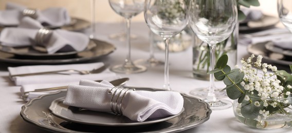 Image of Stylish elegant table setting for festive dinner in restaurant. Banner design