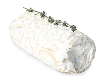 Delicious fresh goat cheese with thyme on white background