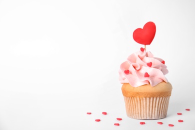 Tasty cupcake on white background. Valentine's Day celebration