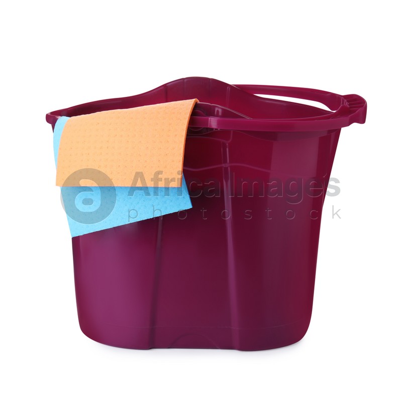 Purple bucket with rags isolated on white