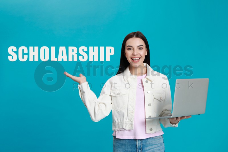 Image of Scholarship concept. Young woman with modern laptop on light blue background