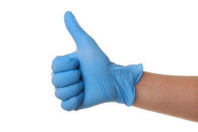Person in blue latex gloves showing thumb up gesture against white background, closeup on hand