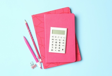 Flat lay composition with different school stationery on light blue background. Back to school