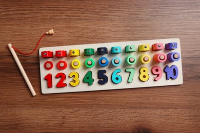 Photo of Math game Fishing for Numbers on wooden table, flat lay