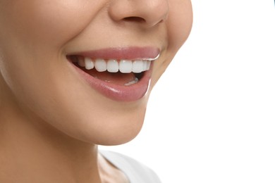 Young woman with healthy teeth on white background, closeup