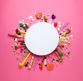 Photo of Frame of festive items on pink background, flat lay with space for text. Surprise party concept