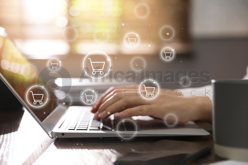 Delivery concept. Woman using modern laptop for online shopping indoors, closeup. Market cart illustrations
