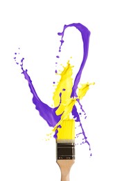 Brush with splashing yellow and violet paints on white background