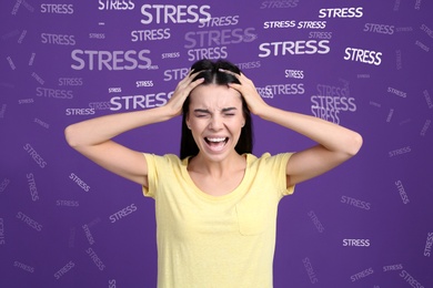 Stressed young woman and text on violet background