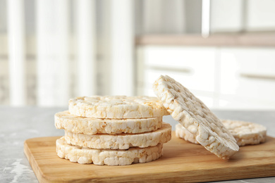 Stack of crunchy rice cakes on grey marble table indoors