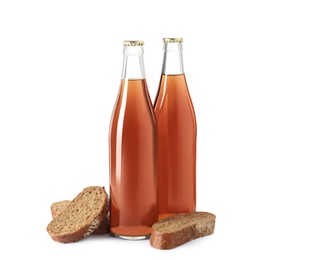 Bottles of delicious fresh kvass and bread isolated on white