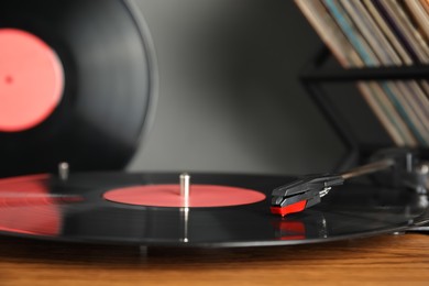 Modern vinyl record player with disc, closeup