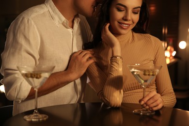 Man and woman flirting with each other in bar, closeup