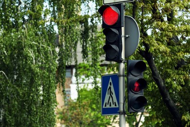 View of modern traffic lights on city street