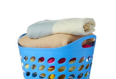 Photo of Blue plastic laundry basket with clean clothes isolated on white