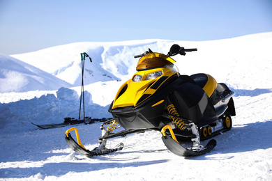 Modern snowmobile at ski resort. Winter vacation