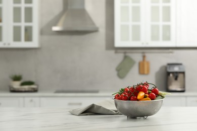 Photo of Fresh clean vegetables on white table in kitchen, space for text