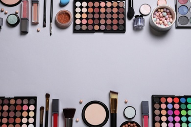 Composition with different cosmetic products on light grey background, top view. Space for text