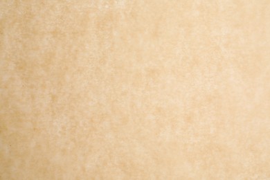 Texture of brown baking paper as background, closeup