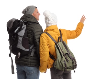 Couple with backpacks on white background, back view. Winter travel
